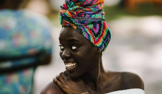 Model wearing colourful African headwrap