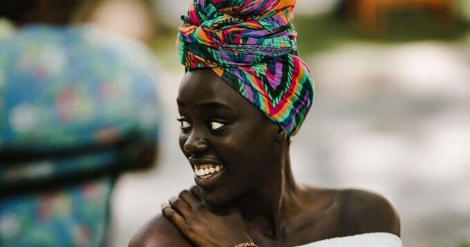 Model wearing colourful African headwrap