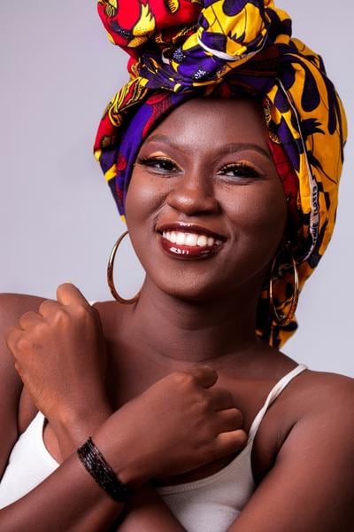 Model wearing African wax print fabric cotton headwrap