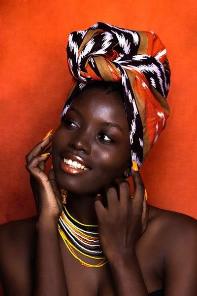 Model wearing silk satin African headscarf