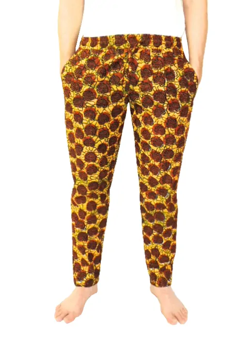 Men's brown yellow African print trousers model wearing front view