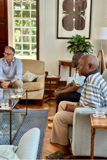 British High Commissioner to Tanzania sat with Kitenge Store master tailor and production manager