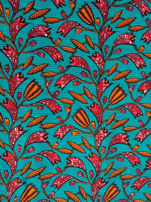 Turquoise orange plant African Ankara fabric closeup